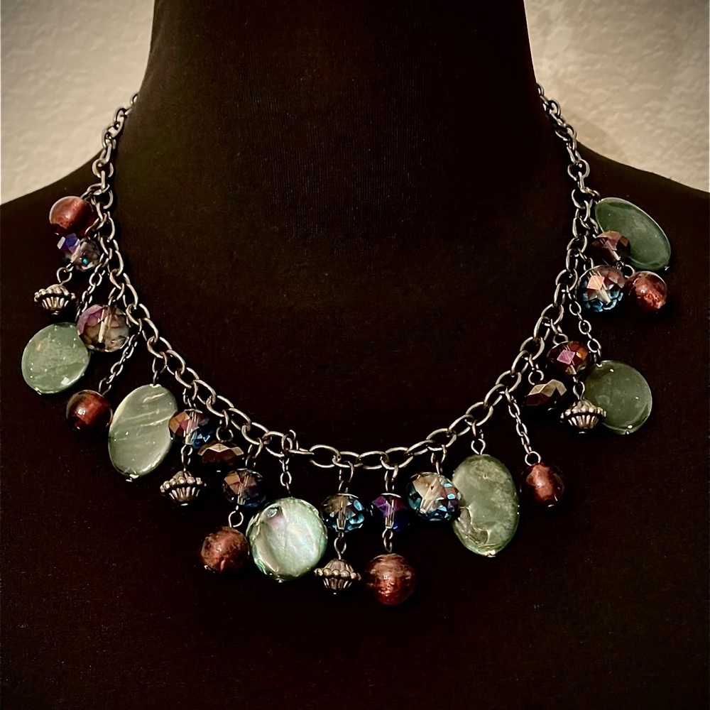 Purple and aqua blue charm necklace with antique silver colored chain.